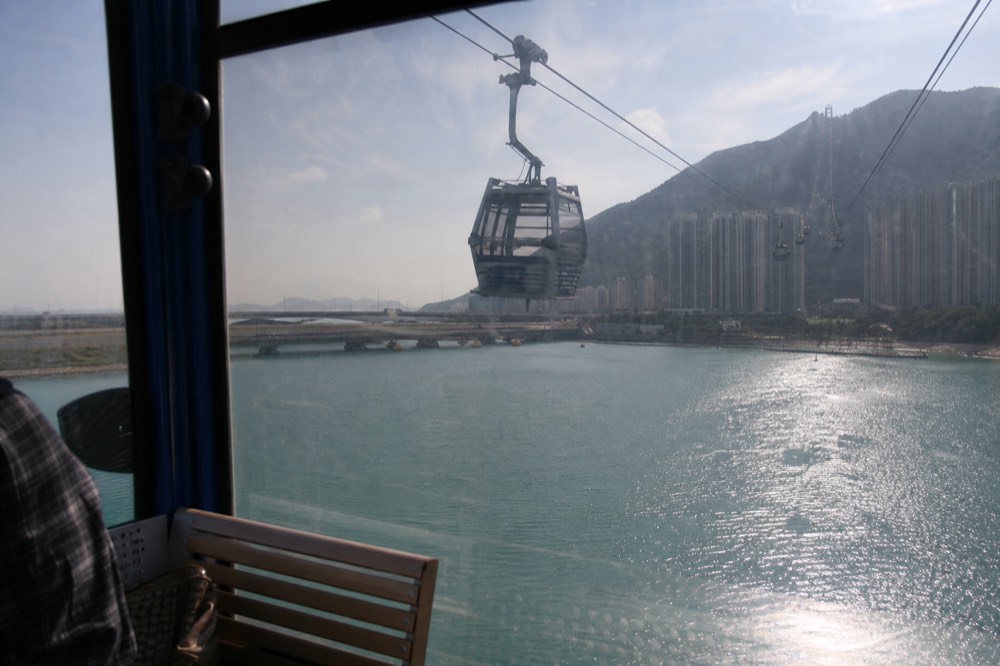 A cable car cabin crossing the channel between Tung Chung and Lantau island, no text, no logos, no people