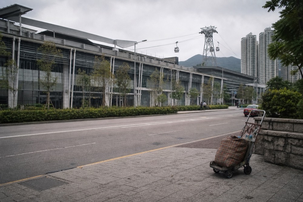 Tung Chung cable car terminal building seen from the street below, no text, no logos, no people