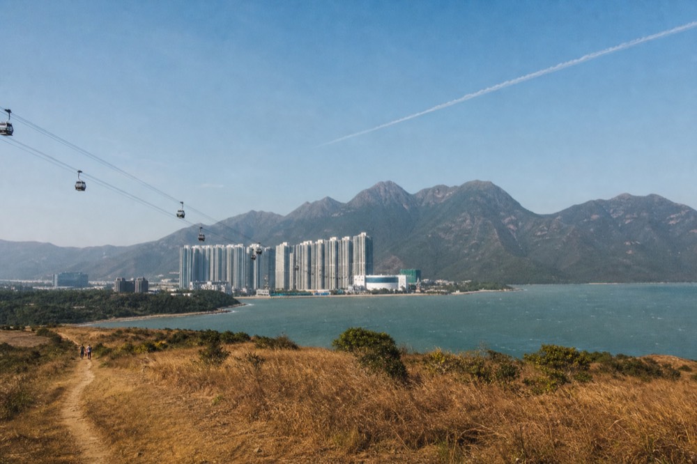 The Lantau coastline and sea under clear autumn light, no text, no logos, no people