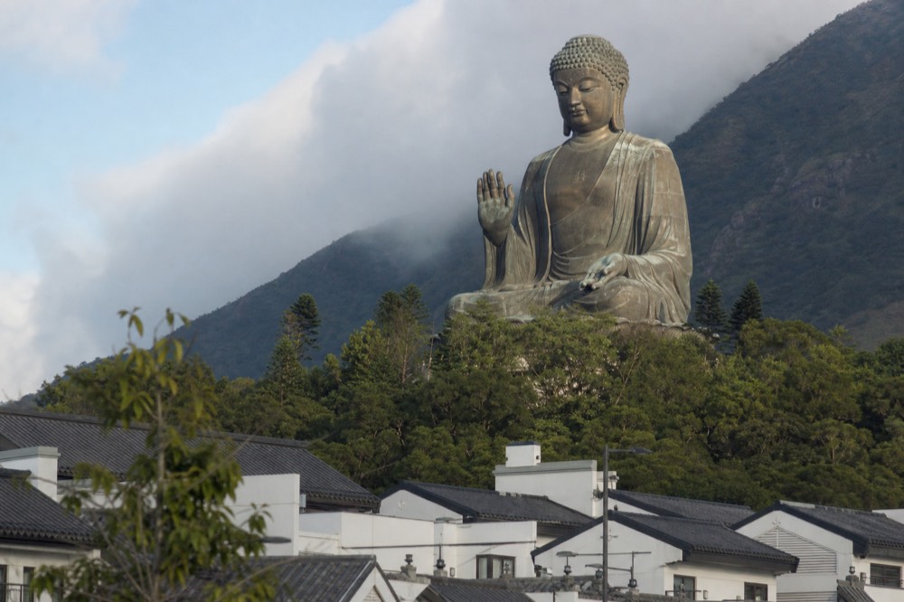 Close-up of the Tian Tan Buddha's face and upper body, no text, no logos, no people