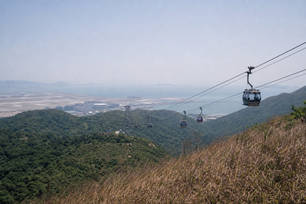 Ngong Ping 360 cable car over Lantau Island, no text, no logos, no people