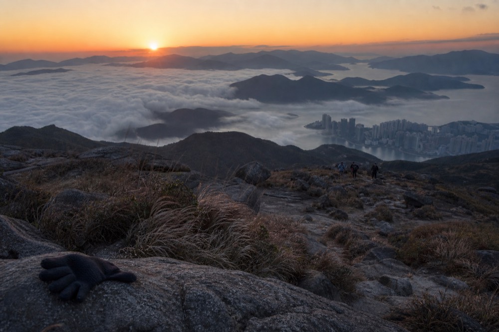 Sunrise from Lantau Peak with mountains in silhouette, no text, no logos, no people