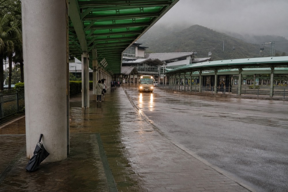 Covered walkway and bus stop outside the Tung Chung terminal, no text, no logos, no people