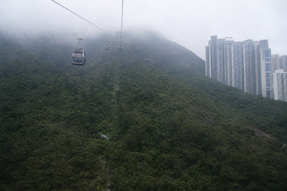 Misty clouds rolling over Lantau peaks at dawn, no text, no logos, no people