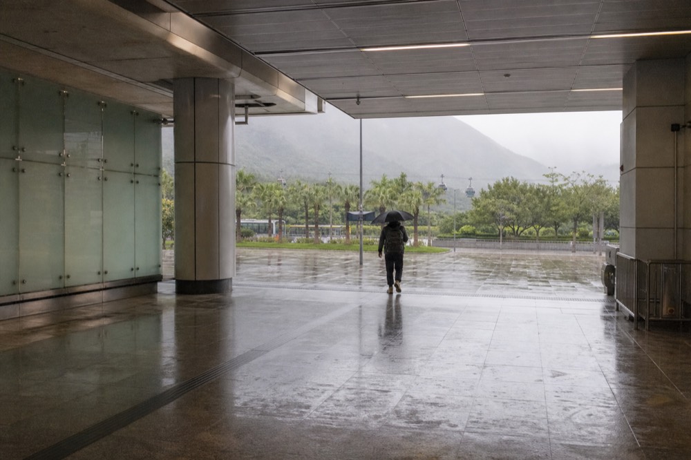 Tung Chung MTR station concourse with the cable car terminal visible beyond, no text, no logos, no people