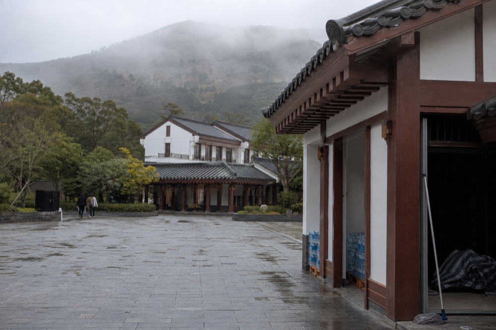 Village square buildings on the Ngong Ping plateau, no text, no logos, no people