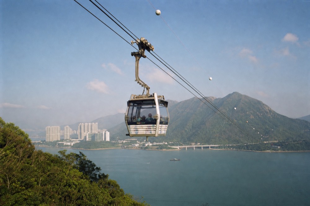 Cable car cabin crossing the bay toward Lantau, no text, no logos, no people