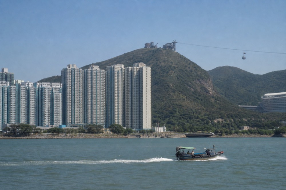 Tung Chung Bay and the cable car against a clear autumn sky, no text, no logos, no people